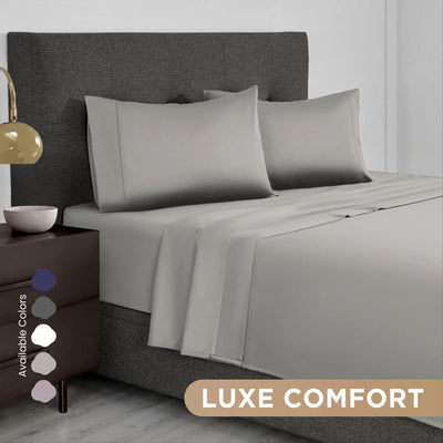 Gray bedding set on a bed.