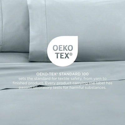 Aqua bedding set with OEKO-TEX label on a neutral background