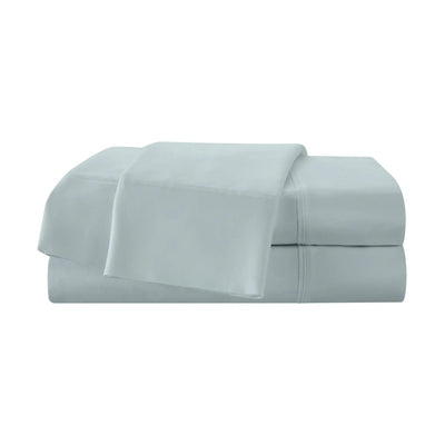 Set of aqua bed sheets on a white background
