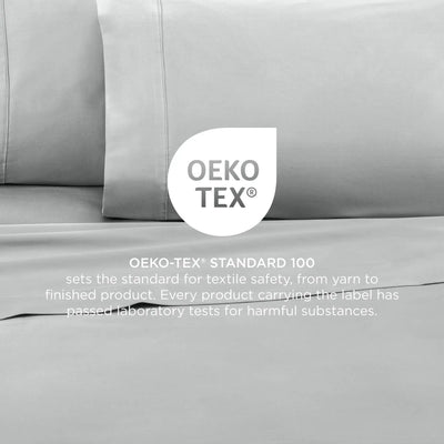 Grey bedding set with OEKO-TEX label on a neutral background
