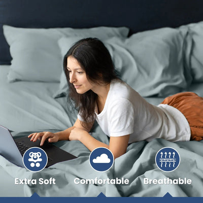 Woman using a laptop on a bed with text 'Extra Soft', 'Comfortable', and 'Breathable' displayed.
