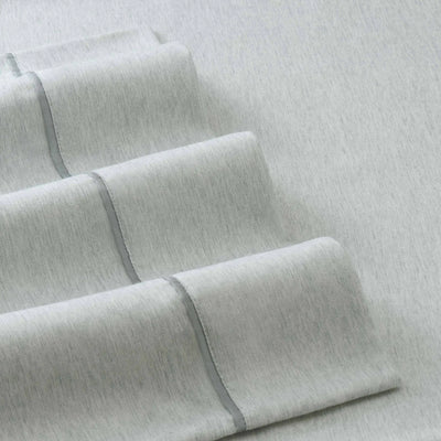 Folded gray fabric on a matching background