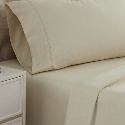 Linen bed sheets and pillow on a bed 
