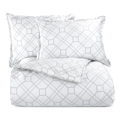 White comforter set with geometric pattern on a white background