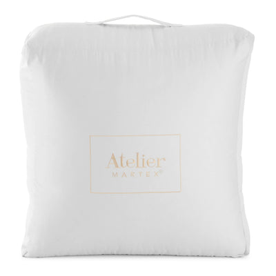 Package comforter with 'Atelier Martex' branding on a white background