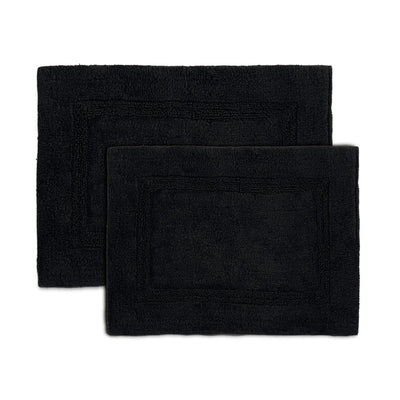 Two black bath rugs on a white background