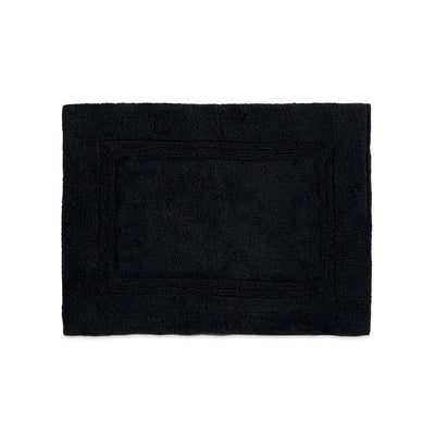 A black rectangular bath rug with a raised border, flat against a solid white background.