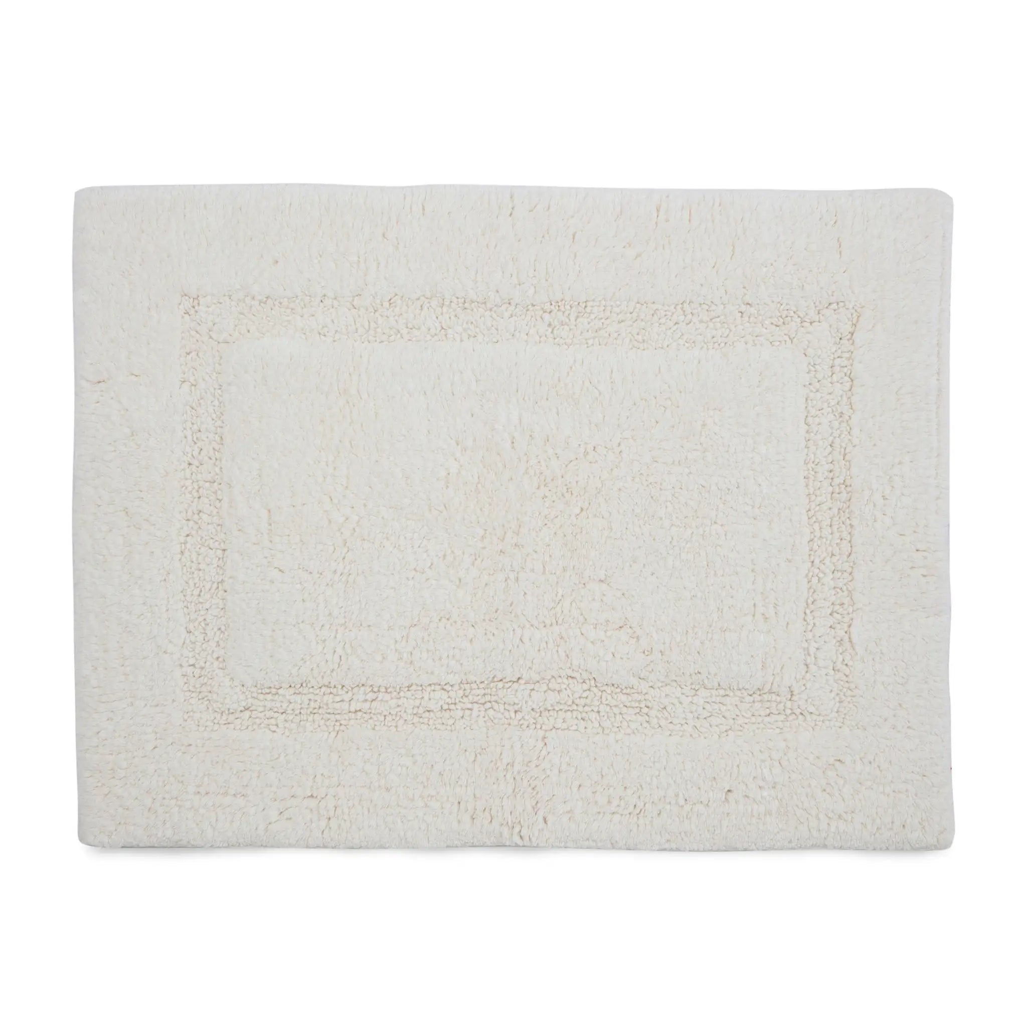 A white rectangular bath rug with a raised border, shown flat against a solid white background.