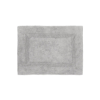Gray bath rug with a textured border on a white background