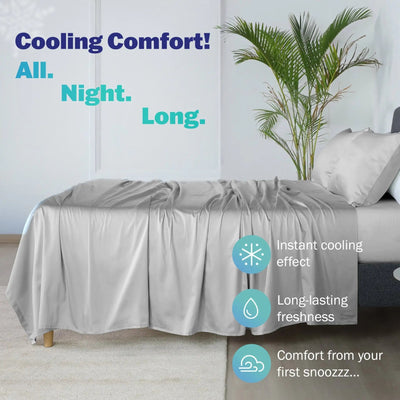 A light gray cooling sheet and pillowcases draped over a bed in a bedroom setting, with text overlays highlighting its instant cooling effect, long-lasting freshness, and comfort from the first snoozze.