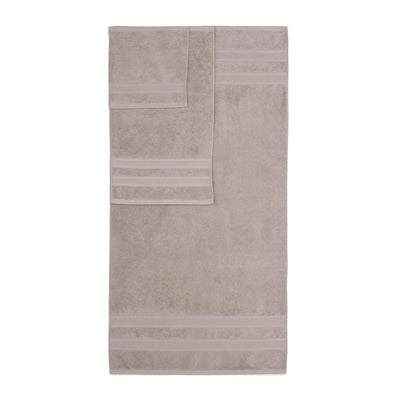 A sand-colored bath towel with horizontal striped borders, displayed flat against a solid white background.