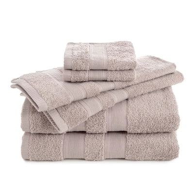 Stack of sand color towel set on a white background