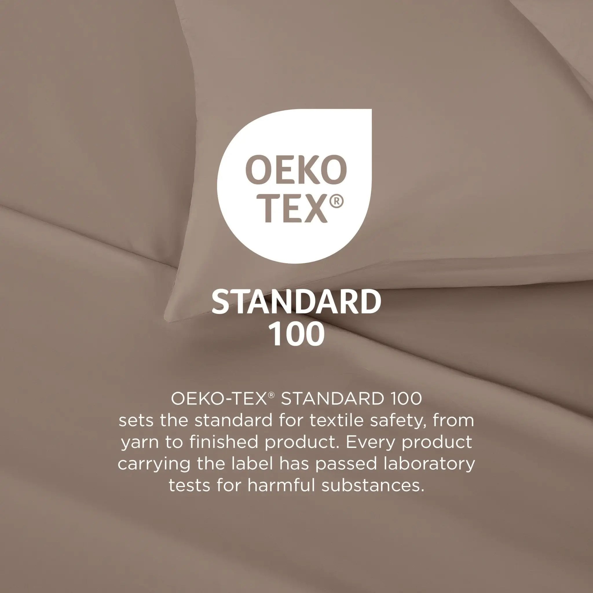 A close-up of draped taupe-beige fabric with a white OEKO-TEX Standard 100 logo and explanatory text overlaid in the center.