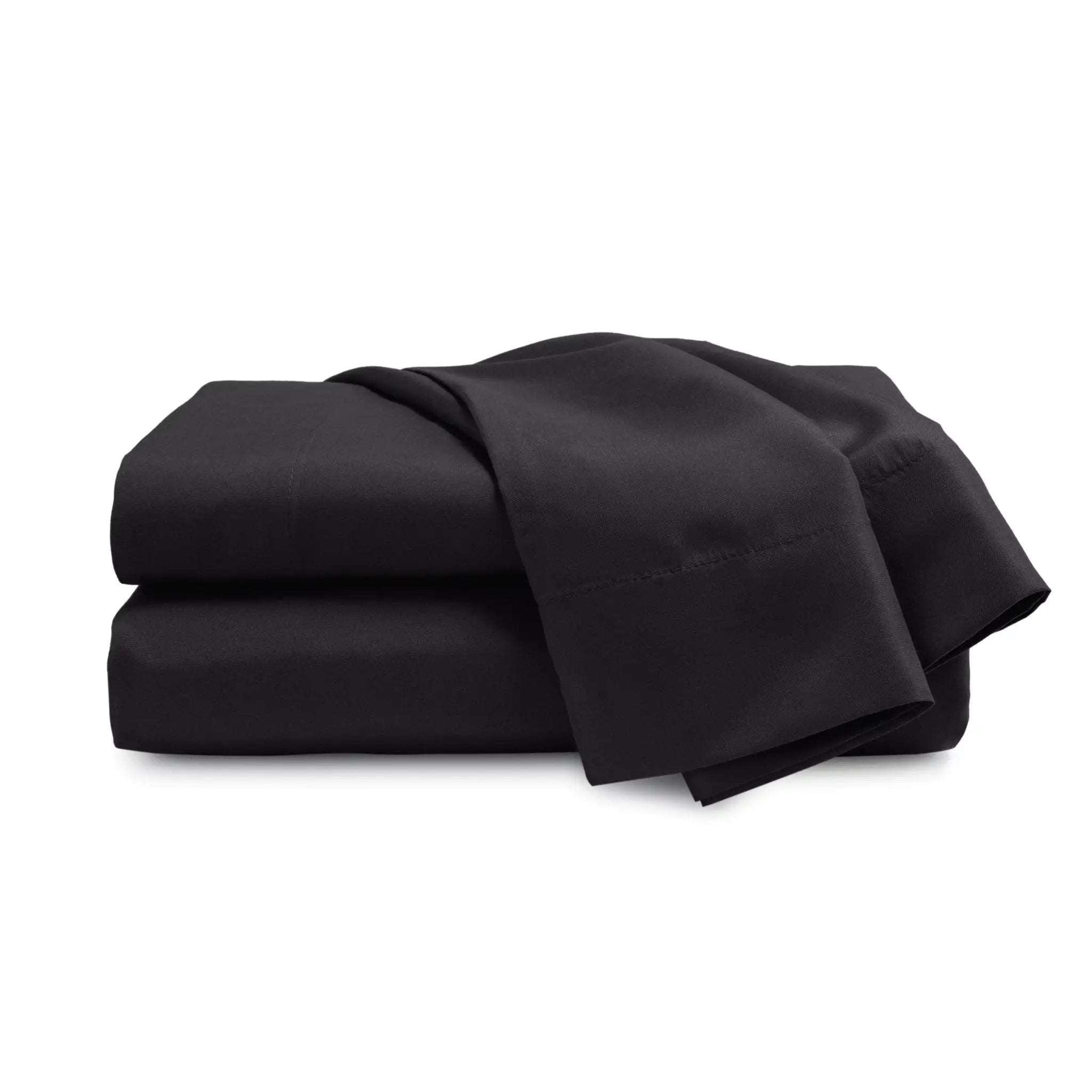 Folded black bed sheets on a white background