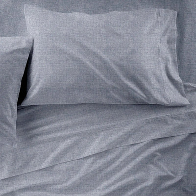 Gray checkered pillowcases on a matching fabric background