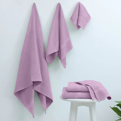 Set of lilac towels on a white background