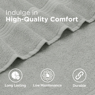 Gray textured fabric with 'Indulge in High-Quality Comfort' text and icons for long-lasting, low-maintenance, and durable properties.