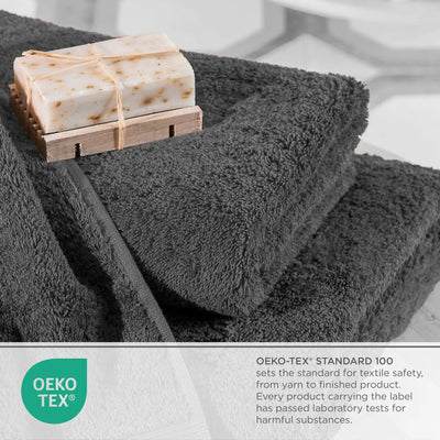 Charcoal towels with a wooden soap dish holding two bars of soap on a light gray background, featuring the OEKO-TEX logo.