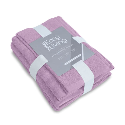 Folded lilac towel with a label on a white background