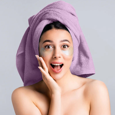 Woman with lilac towel wrapped on head.