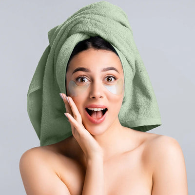 Woman with green towel on head.