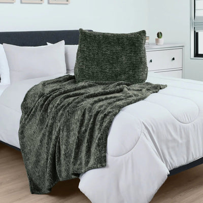 Green pillow over a bed with white bedding in a bedroom setting.