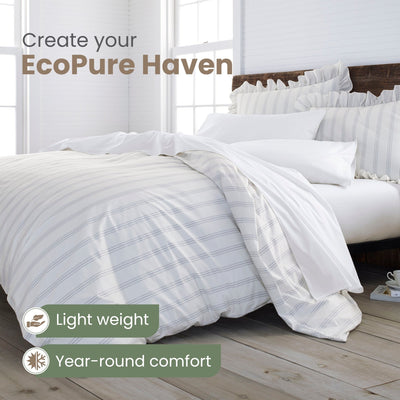Bed with white comforter set and text 'Create your EcoPure Haven' in a bright bedroom.