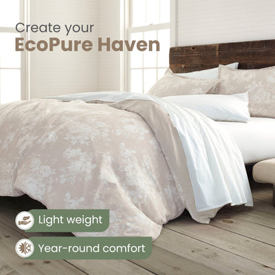 Bed with floral comforter set and text promoting EcoPure Haven, featuring light weight and year-round comfort.