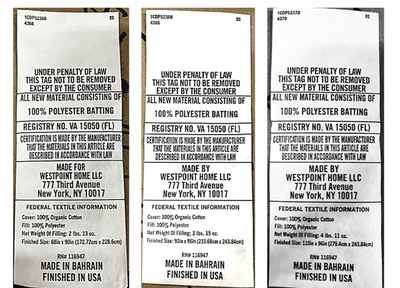 Three identical labels with text and branding information on a wooden surface.