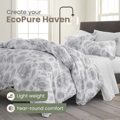 Bed with floral comforter set and text promoting EcoPure Haven, featuring light weight and year-round comfort.