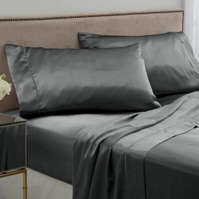 Gray bedding set on a bed.