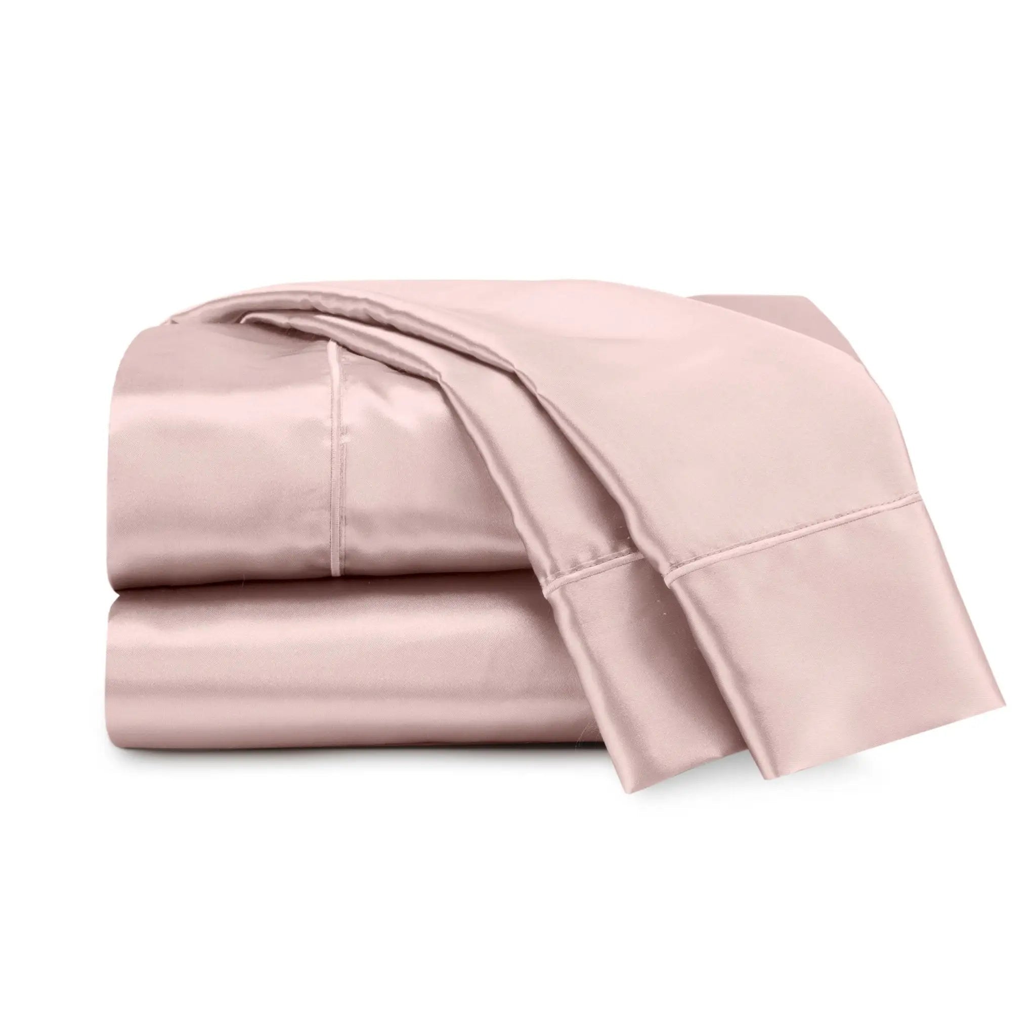 Folded pink bed sheets on a white background
