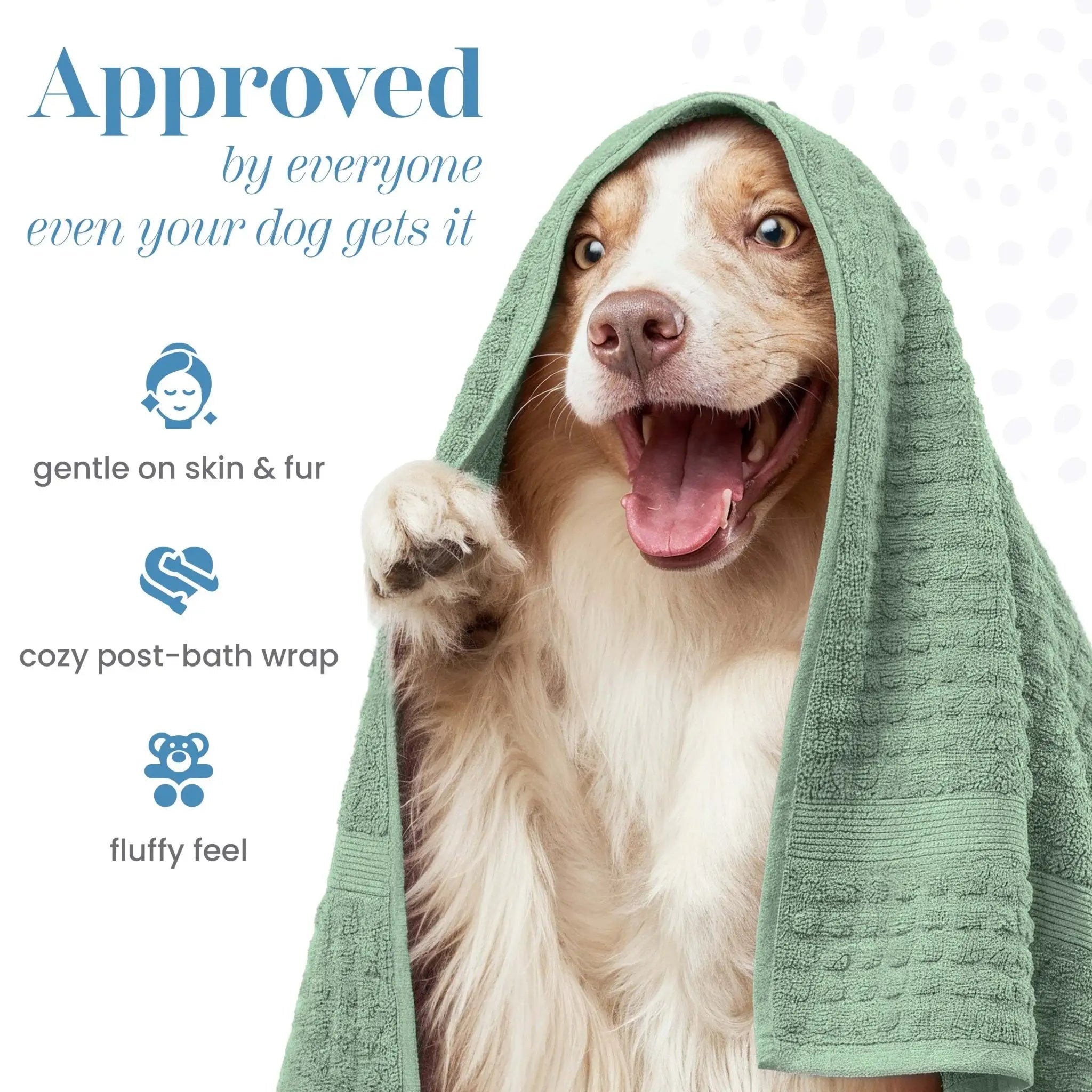 A smiling dog wrapped in a sage textured towel hood, with marketing text on the left reading 'Approved by everyone even your dog gets it' and icons for gentle on skin & fur, cozy post-bath wrap, and fluffy feel.