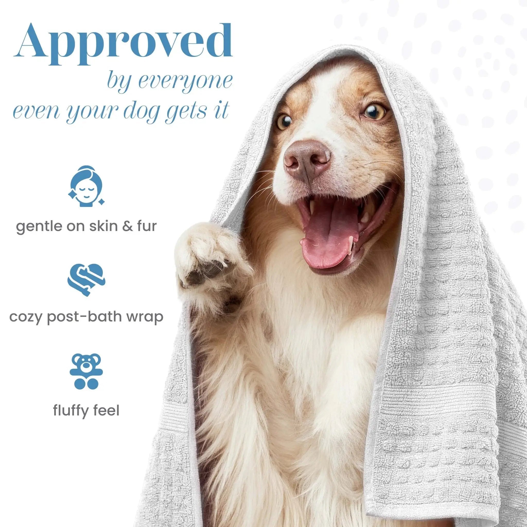 A smiling dog with a white towel wrapped. The image includes text on the left reading 'Approved by everyone even your dog gets it' with icons and phrases 'gentle on skin & fur', 'cozy post-bath wrap', and 'fluffy feel'.
