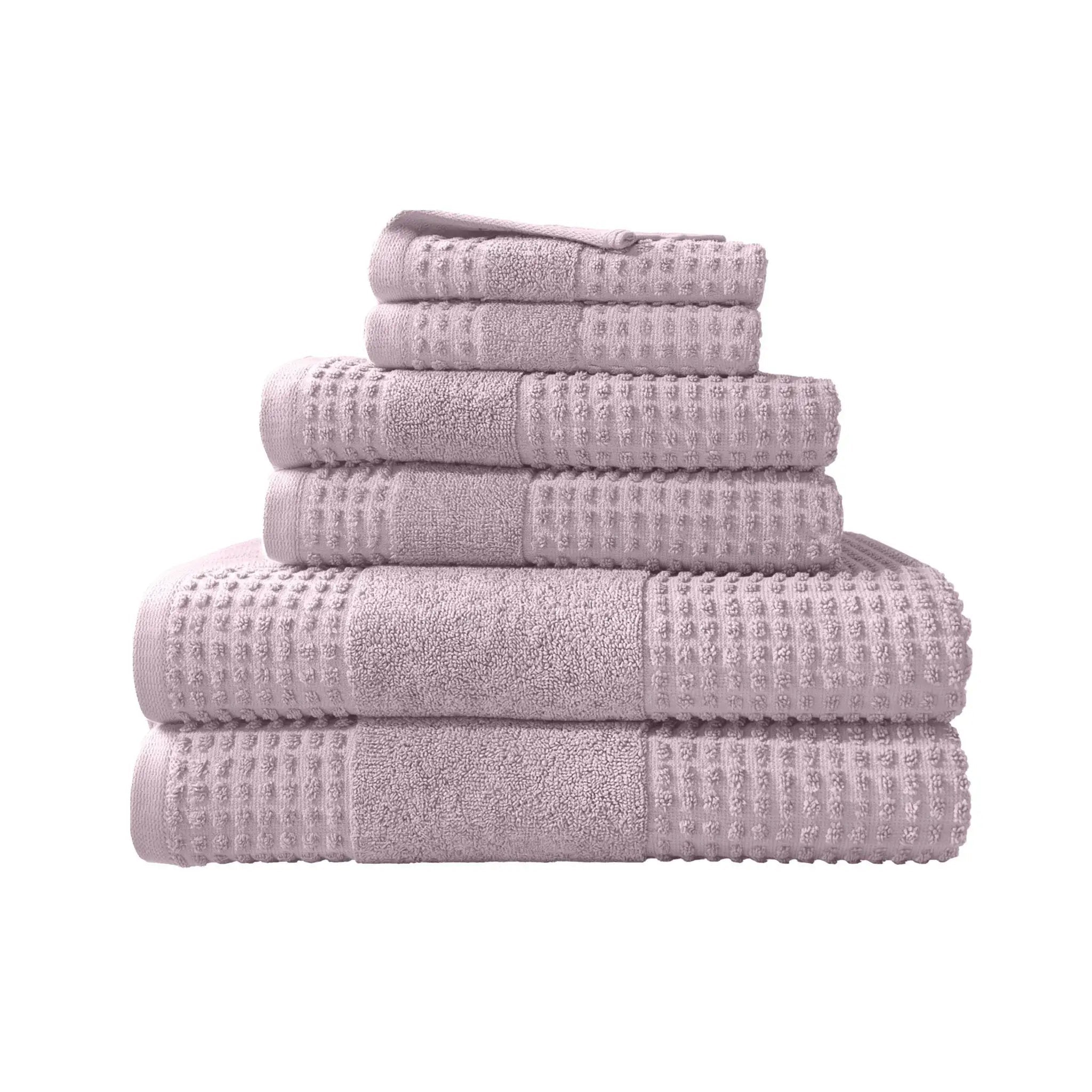 Stack of lilac towel set on a white background