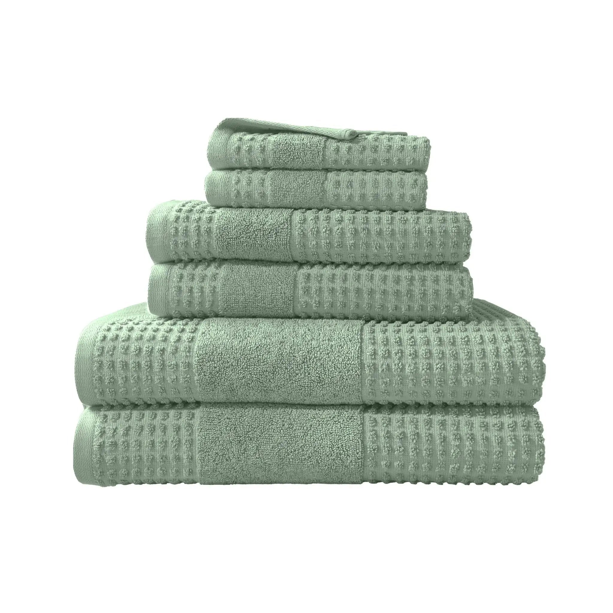 Stack of sage towel set on a white background