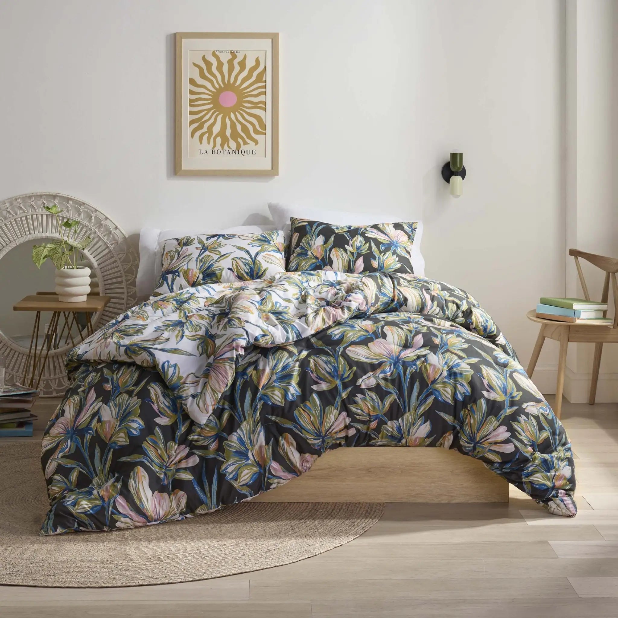 Floral comforter set on a bed in a bedroom.