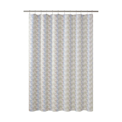 A shower curtain featuring a vertical geometric pattern of triangles in light blue, gray, and cream, hanging from a silver metal rod against a plain white background.