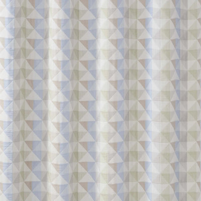 A close-up of a fabric surface with a repeating geometric triangle pattern in soft off-white, pale blue, and muted beige.
