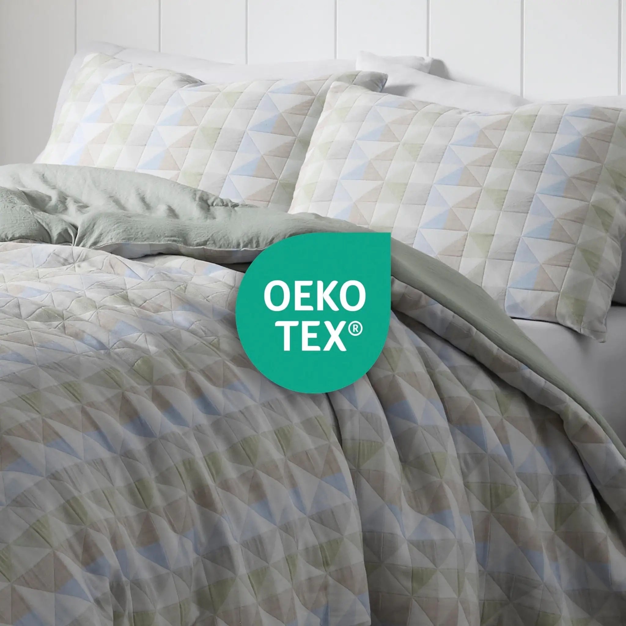 Comforter set with geometric pattern and OEKO-TEX logo on a white background