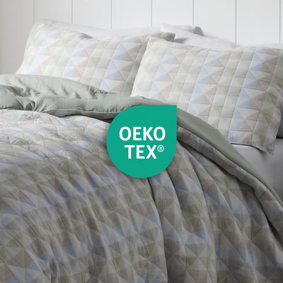 Bedding set with geometric pattern and OEKO-TEX logo on a white background