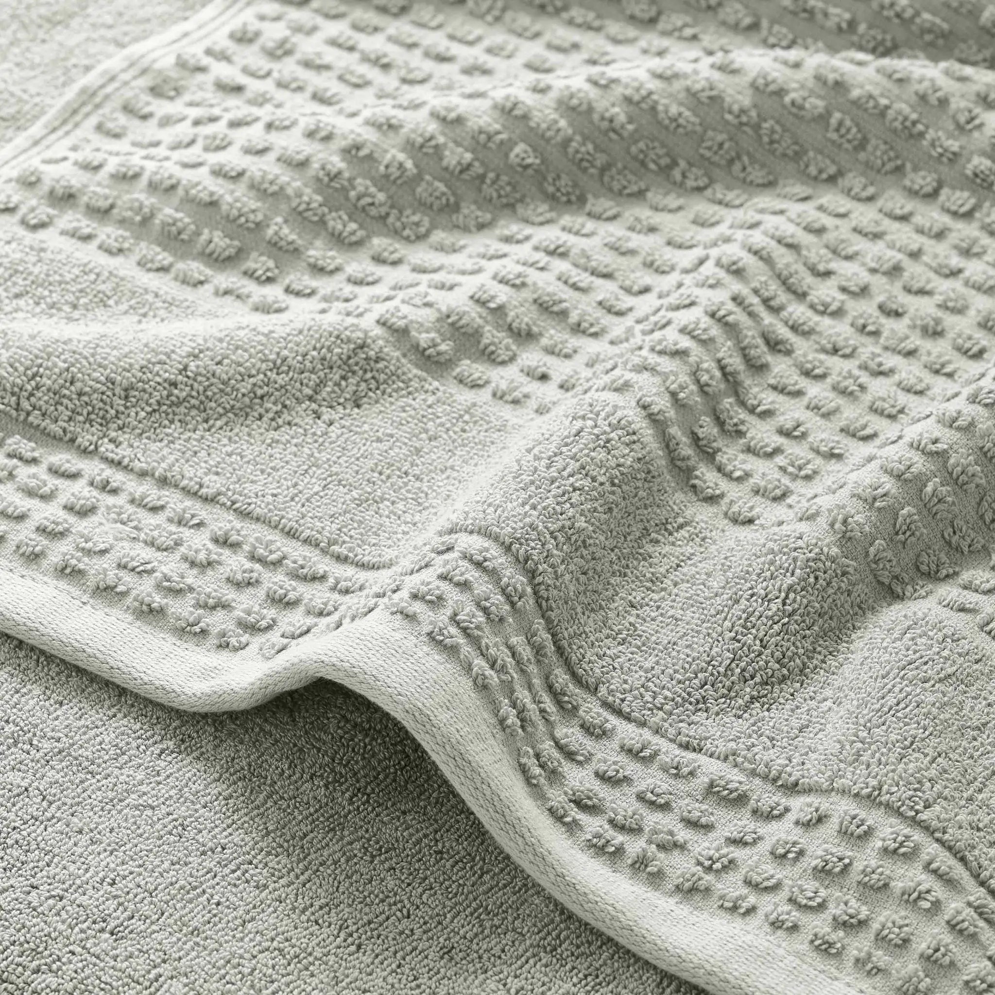 Close-up of a textured grey bath towel