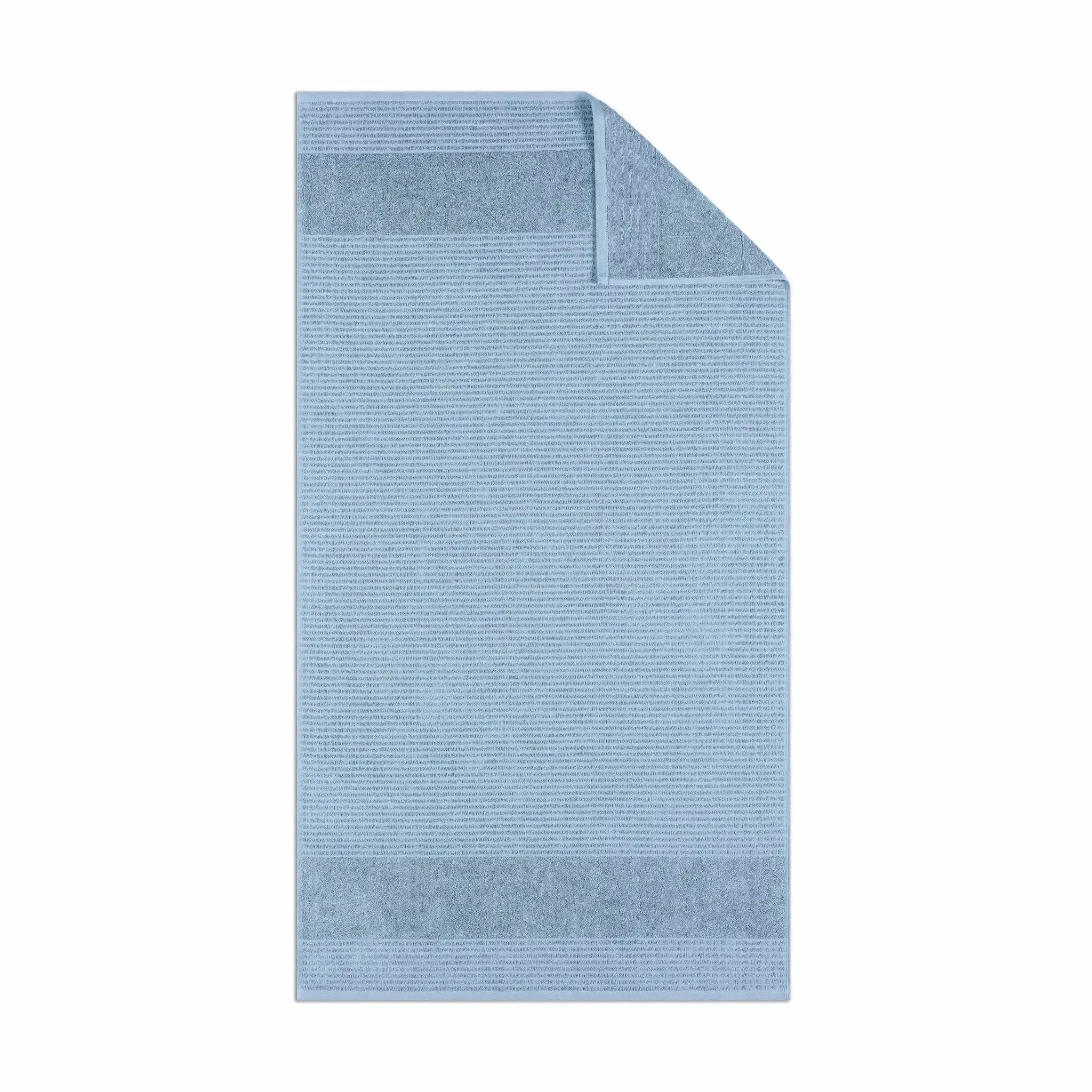 Blue textured bath towel fabric on a white background