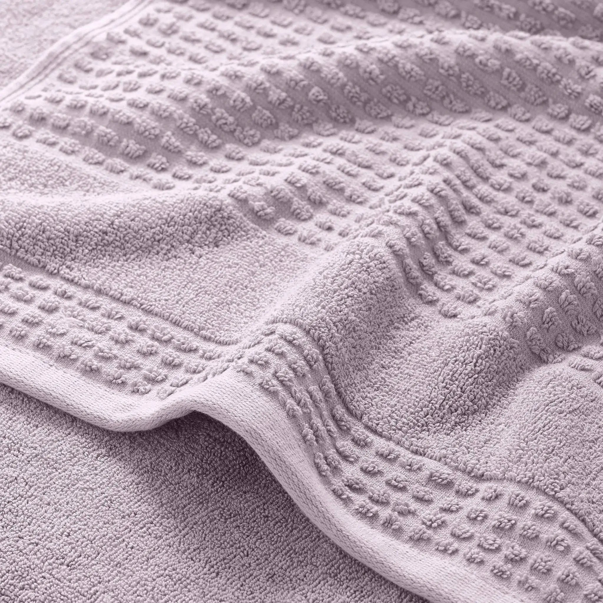 Close-up of a textured lilac bath towel