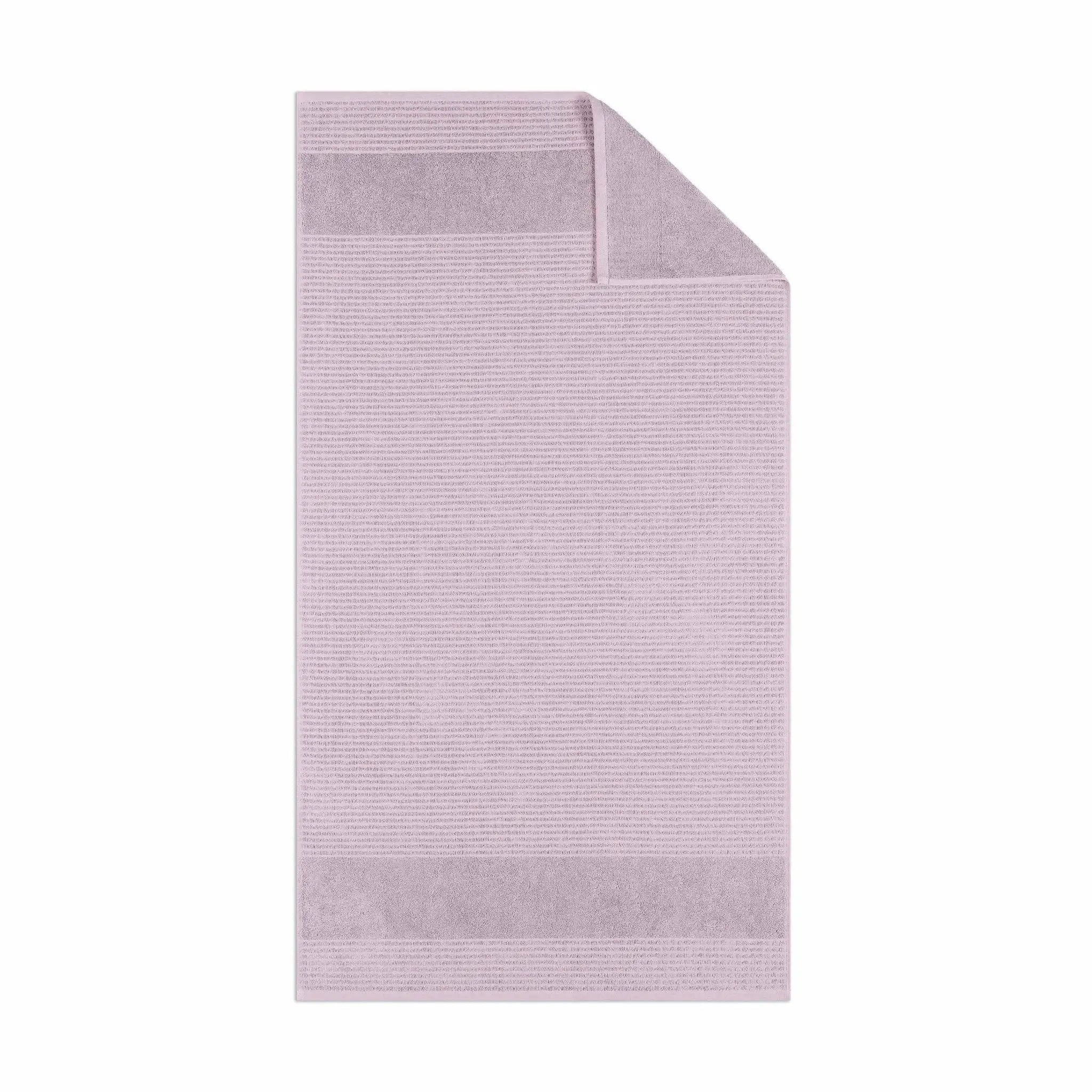 Lilac textured bath towel fabric on a white background
