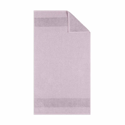 Lilac textured bath towel fabric on a white background