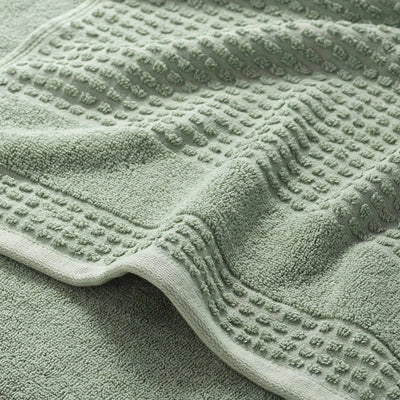 Close-up of a textured sage bath towel