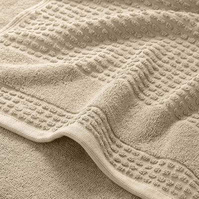 Close-up of a textured sand color bath towel