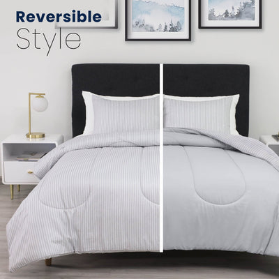 Gray striped comforter set on a bed with 'Reversible Style' text above.