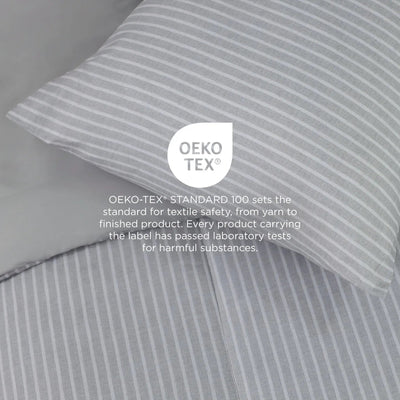 Gray striped fabric with OEKO-TEX label on a gray background